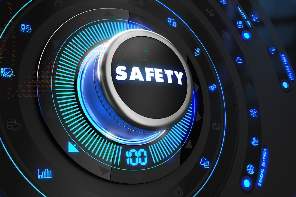Safety Controller on Black Control Console with Blue Backlight. Increase, improvement, control or management concept.